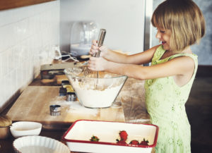 girl helping with cooking