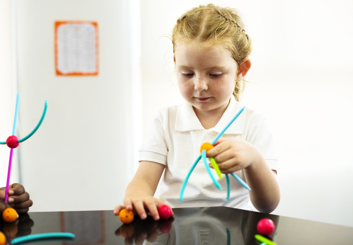 Montessori at home girl doing activity