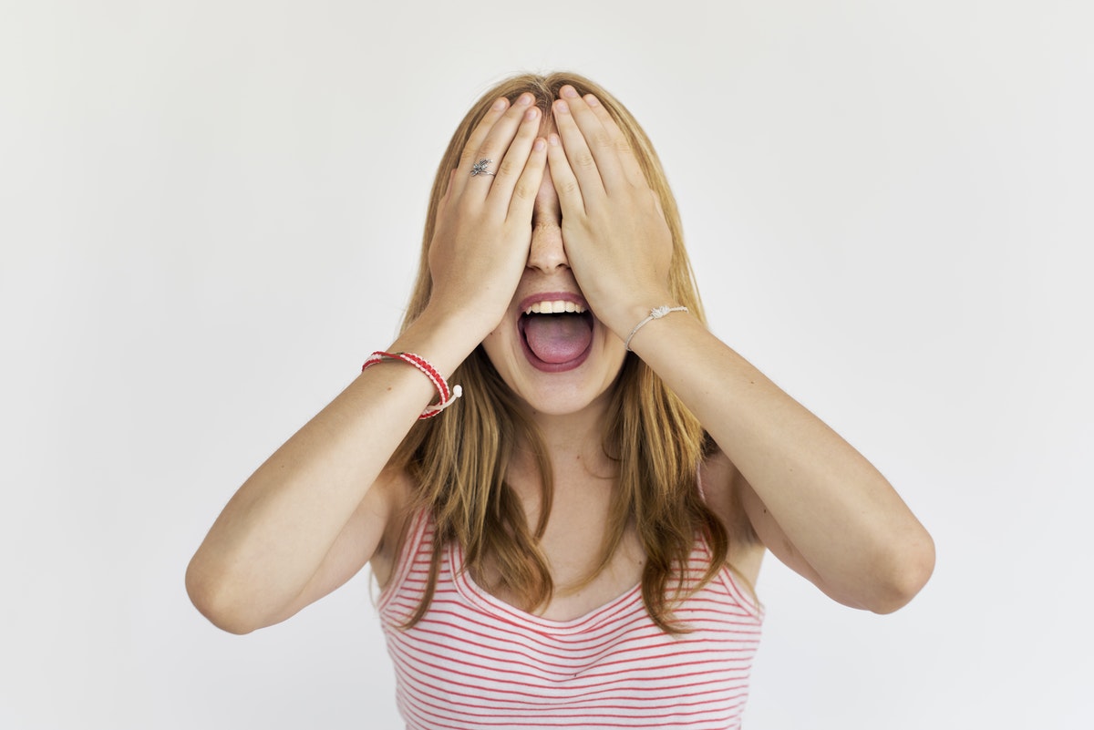 How to change your mindset about money woman covering her eyes